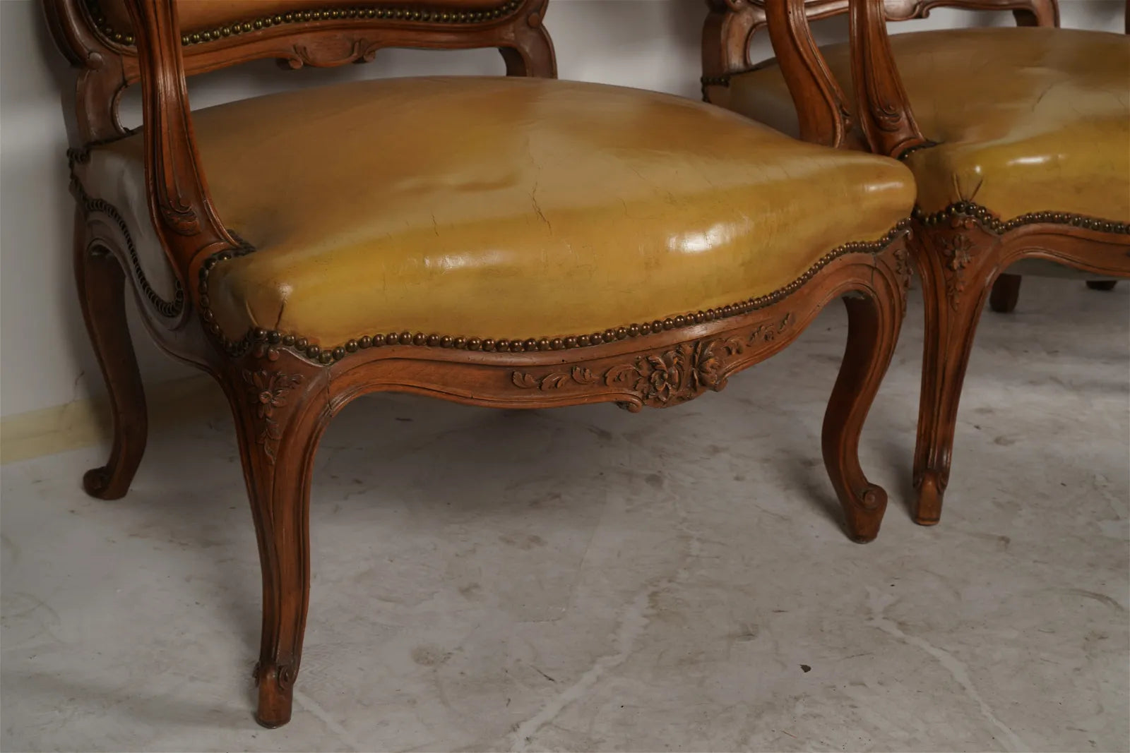 AF2-037: Pair of Late 20th Century French Provincial Fruitwood Fauteuils w/ Leather Upholstery