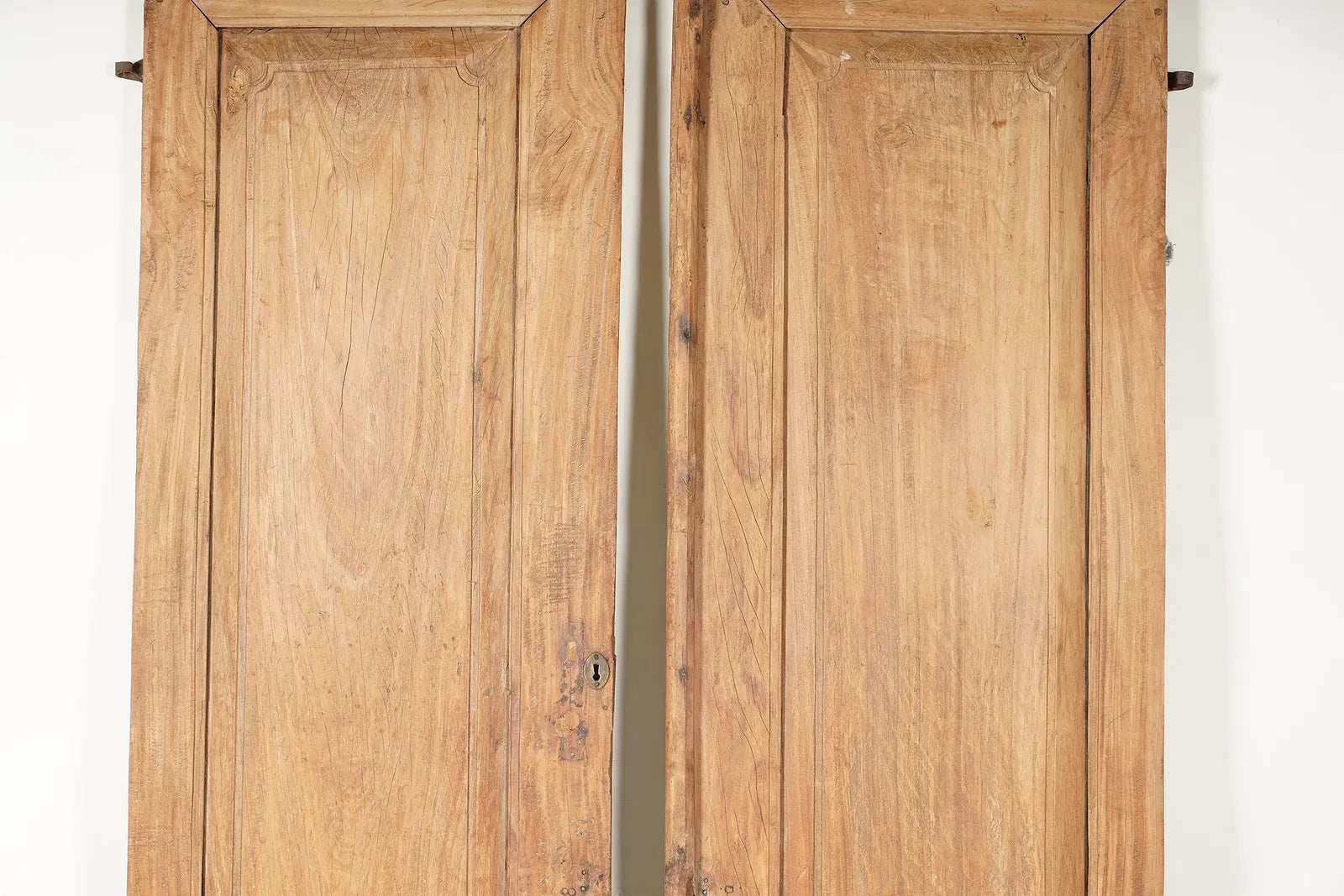 AA7-040: Pair of Rustic Walnut Paneled Doors With Iron Hinges