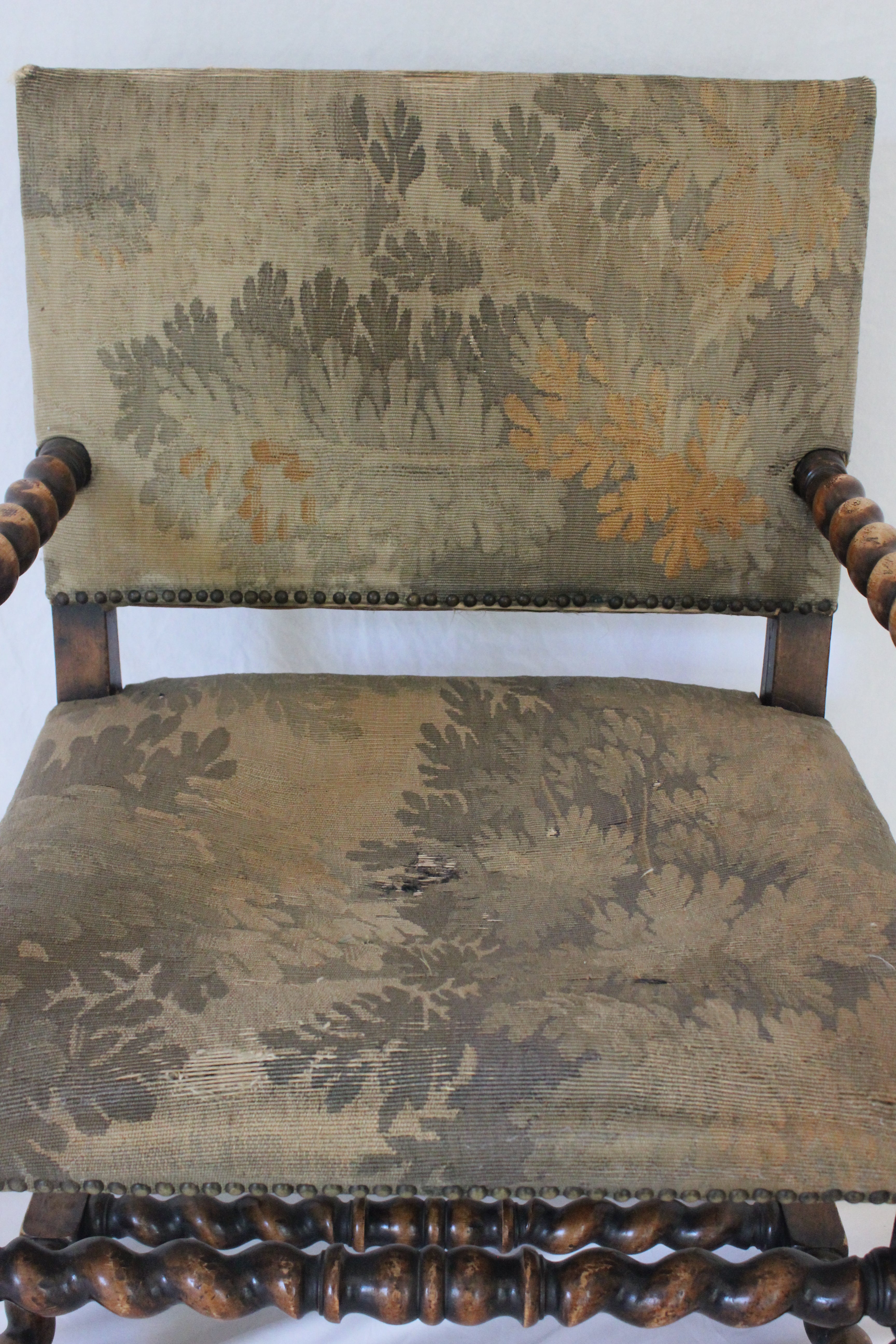 AF2-374: Antique Pair of Early 19th Century Louis XII Style Carved Walnut Arm Chairs w/ Tapestry Remnant Upholstery
